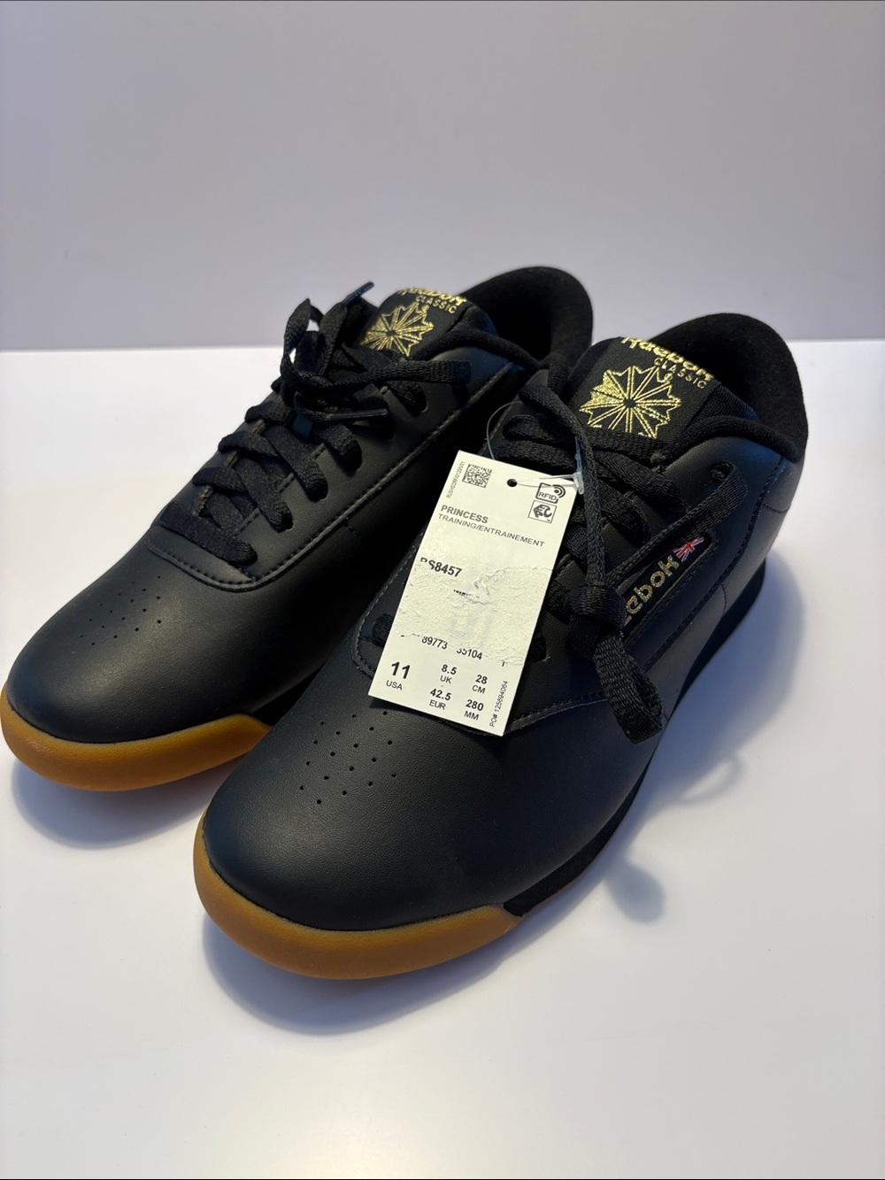 Reebok Classic NWT size 11 Women’s Black Sneakers with Gum Outsole and Gold Logo